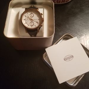 Fossil watch with leather straps and gold accents